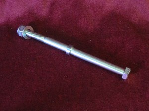 Swinging arm spindle complete with spacer and nut